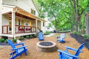a group of blue chairs sitting in front of a house at Musician's Ranch in Franklin