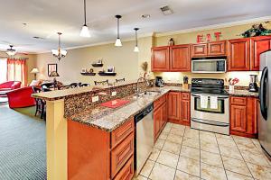 a large kitchen with wooden cabinets and appliances at Summit Manor Condos Unit B3062 in Gatlinburg