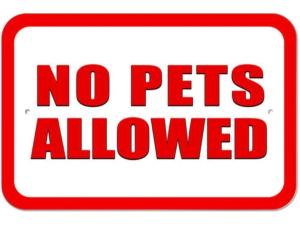 a red and white sign with no pets allowed at Mandara Tree Villas in Kampong Sum Sum