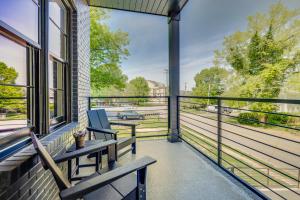 a balcony with a bench and a view of a street at Brio West End in Nashville