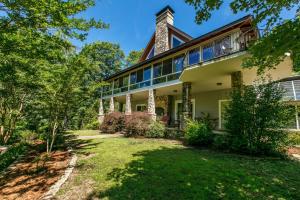 an exterior view of a house with a yard at Hidden Cove in Lake Lure
