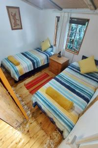 Postel nebo postele na pokoji v ubytování Blue Space Beach Shack