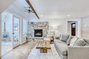a living room with a couch and a fireplace at Forest Hideaway in Sunriver