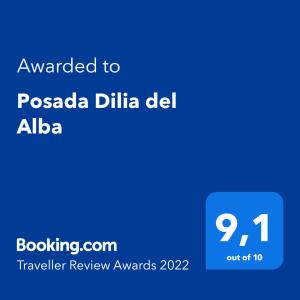 Sertifikat, penghargaan, tanda, atau dokumen yang dipajang di Posada Dilia del Alba