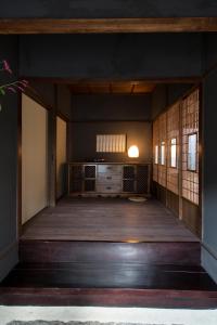 an entrance to a room with a wooden floor at Kitahama Sumiyoshi in Takamatsu