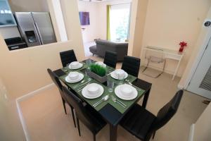 a dining room table and chairs in a living room at Modern 3 Bedroom Condo In Private Community #5 in Petit Valley