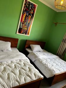 Cama o camas de una habitación en City Retreat Arusha