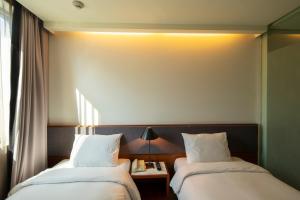 Cama o camas de una habitación en Seoul Hotel ShinShin