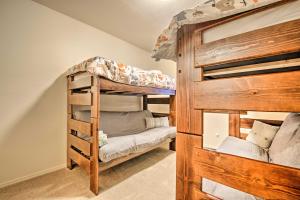 a bedroom with two bunk beds in a room at Deck and Gas Grill Spacious Pinetop Cabin in Indian Pine