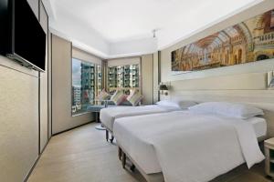 Giường trong phòng chung tại Hotel Alexandra