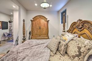 a bedroom with a large bed with a wooden headboard at Pet Friendly Milk Barn Cottage on 15 Acres! in Franklin