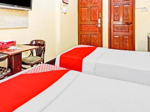 Postel nebo postele na pokoji v ubytování Al Arraf Hotel