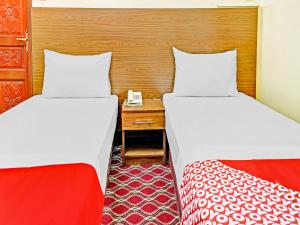 Postel nebo postele na pokoji v ubytování Al Arraf Hotel