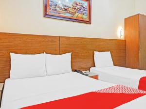 Postel nebo postele na pokoji v ubytování Al Arraf Hotel