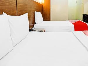 Postel nebo postele na pokoji v ubytování Al Arraf Hotel