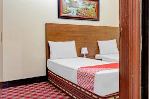 Postel nebo postele na pokoji v ubytování Al Arraf Hotel