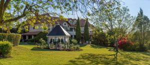 a large house with a gazebo in a yard at Oliver`s in White River