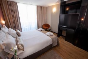 Postel nebo postele na pokoji v ubytování Boutique Hotel Bura 45N