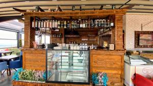 a bar in a restaurant with a display case at Heaven Suite Hotel in Trabzon