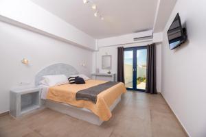 Postel nebo postele na pokoji v ubytování Villa Waves + 18 fotografií