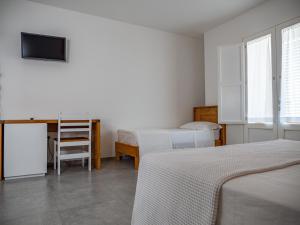 Postel nebo postele na pokoji v ubytování A est b&b Otranto