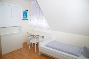 Postel nebo postele na pokoji v ubytování Ferienhaus Rike