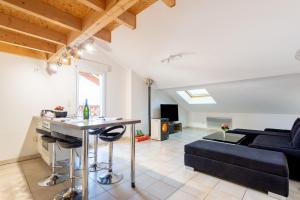 a living room with a couch and a table at Bellevue in La Bresse
