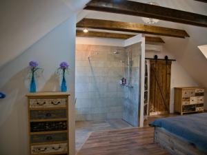 a master bathroom with a shower and a sink at Apartman Vulcano in Zvolen