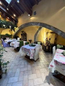 a restaurant with tables and chairs in a room at Medieval House in Viterbo +62 photos