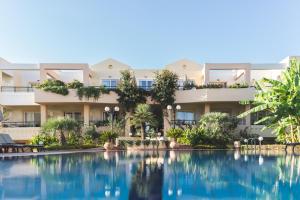 a view of the hotel from the pool at Helios Apartments in Kato Daratso +29 photos