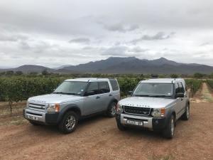 two trucks parked next to each other on a dirt road at Mountain View Eco Lodge Montagu in Montagu