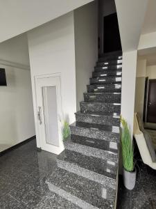 a staircase in a building with a white door at Bled Paradise Apartments in Bled