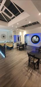 a large room with tables and ping pong balls at Charnwood Regency Guest House in Loughborough