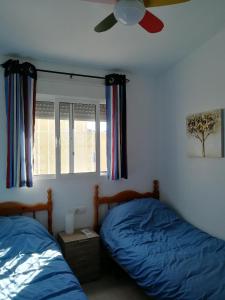 Ein Bett oder Betten in einem Zimmer der Unterkunft Casa Joleen 2