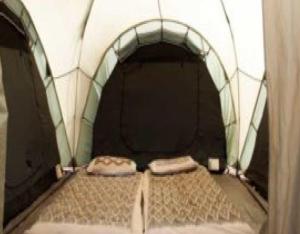 a small tunnel with a bed in it at StayApart - Deccan Trails Vikarabad in Vikārābād