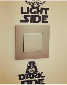 a lightswitch with a dark side sign on a wall at StarMountainApartment in Seia