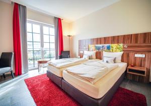 Een bed of bedden in een kamer bij Hotel Cochemer Jung