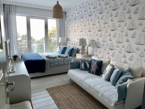 Posezení v ubytování Biały Apartament Hampton w Playa Baltis