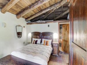 A bed or beds in a room at Belvilla by OYO Mulino