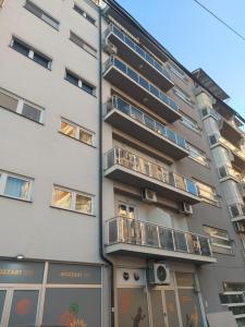 an apartment building with balconies on the side of it at Art B in Ohrid