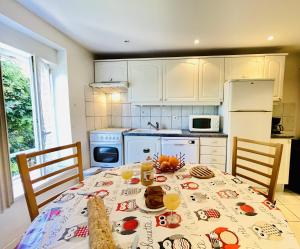a kitchen with a table with food on it at Residence Louis Le Lavoir in Bains-les-Bains