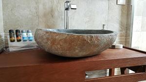 a large bowl sink on a counter in a bathroom at Sarakiniko Rooms in Adamantas