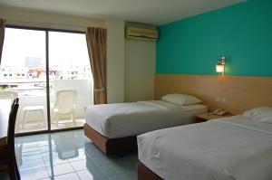 Кровать или кровати в номере Baan Manthana House