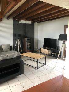 a living room with a couch and a coffee table at Quinta in Argy