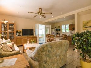 a living room with a couch and a table at Sunny house with private pool in Nadaillac-de-Rouge