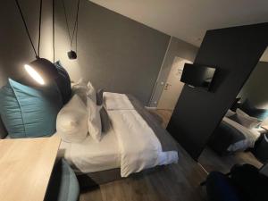 Voodi või voodid majutusasutuse Hotel Falkenturm toas