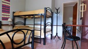 Una cama o camas cuchetas en una habitación  de Vila Sornico
