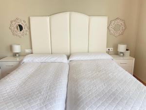 Postel nebo postele na pokoji v ubytování Apartment Lucena Center Atico Parking Gratis