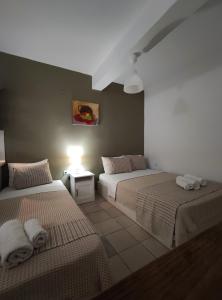 A bed or beds in a room at Aitherial Summer House