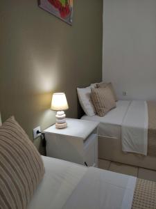 A bed or beds in a room at Aitherial Summer House